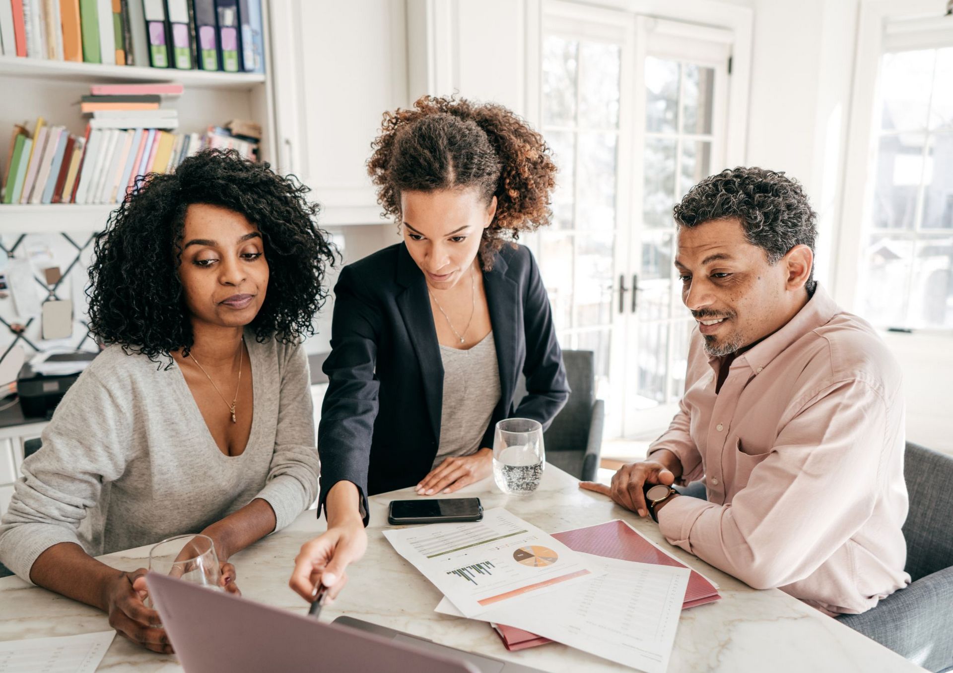 JMR Insurance - staff overlooking paperwork in an office