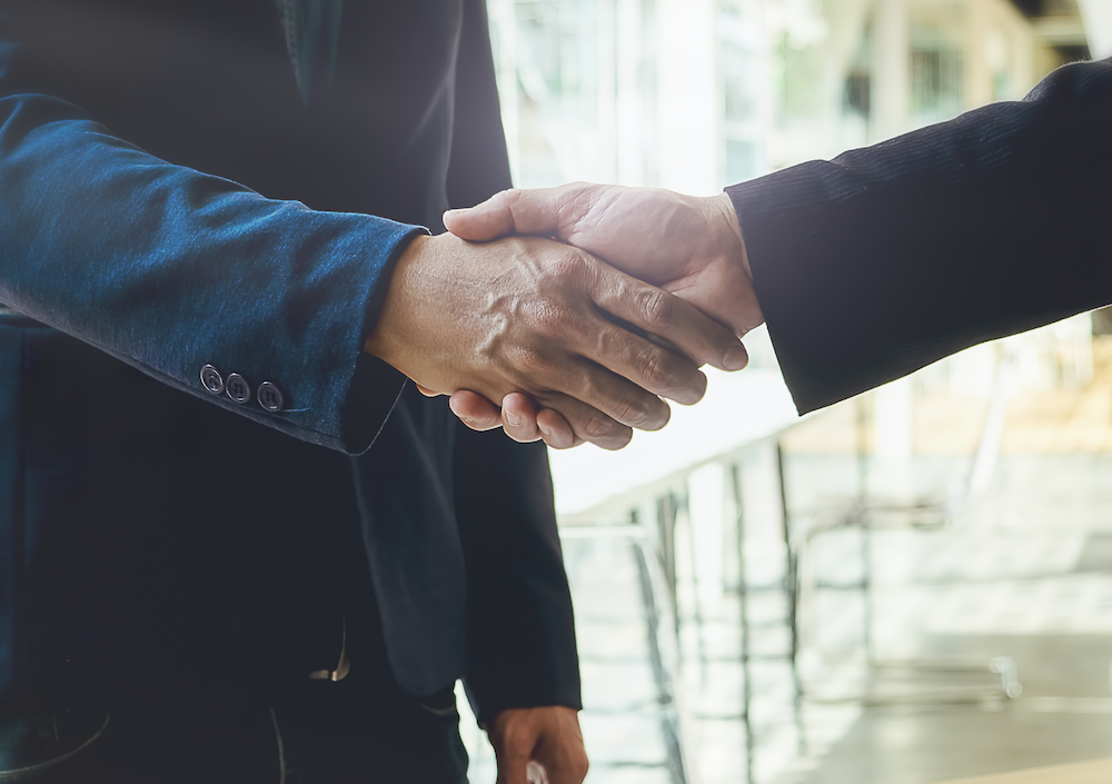 JMR Insurance - image of 2 people shaking hands